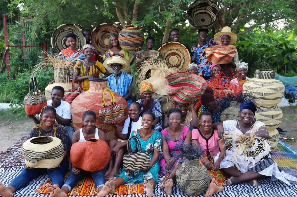 Baba Tree basket makers gathered together with their colourful finished baskets